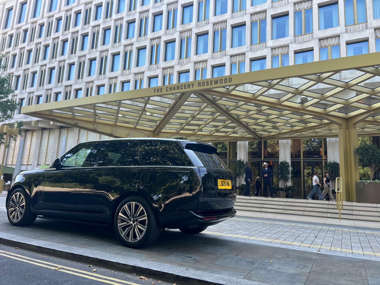 Range Rover chauffeur vehicle outside a luxury London hotel